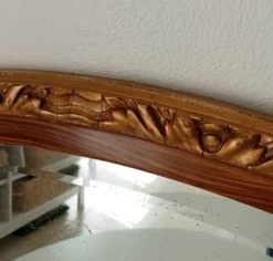 Miroir ovale ancien glace biseauté en bois et stuc XIXeme