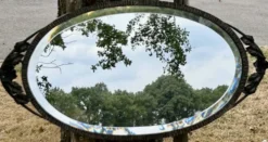 Miroir ovale biseauté art déco fer forgé richement travaillé