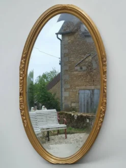 Miroir ovale en bois doré, style Louis XVI