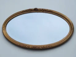 Miroir ovale en bois doré, style Louis XVI