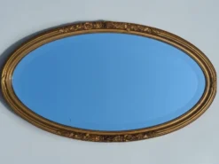 Miroir ovale en bois doré, style Louis XVI