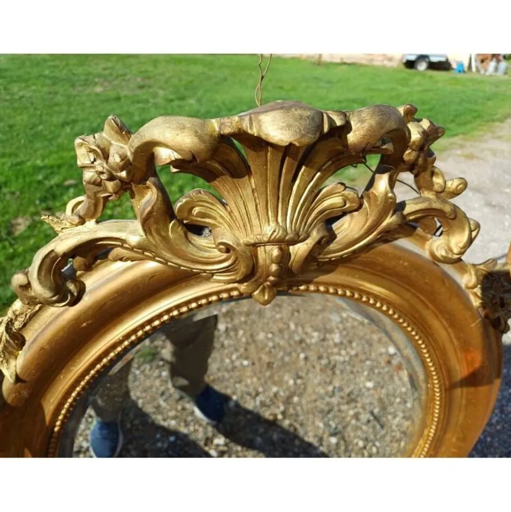 Miroir ovale en bois et stuc doré 19ème