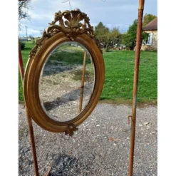 Miroir ovale en bois et stuc doré 19ème