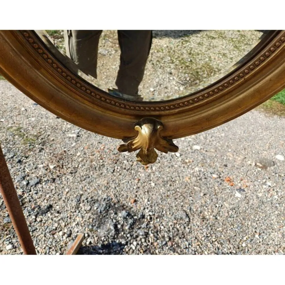 Miroir ovale en bois et stuc doré 19ème