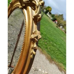 Miroir ovale en bois et stuc doré 19ème