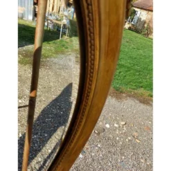 Miroir ovale en bois et stuc doré 19ème