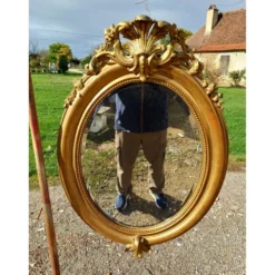Miroir ovale en bois et stuc doré 19ème