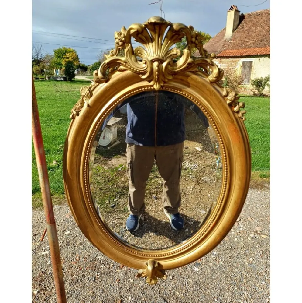 Miroir ovale en bois et stuc doré 19ème