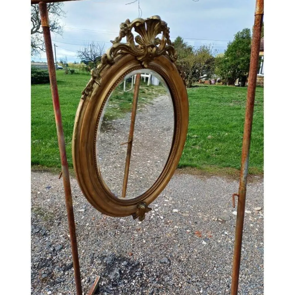 Miroir ovale en bois et stuc doré 19ème