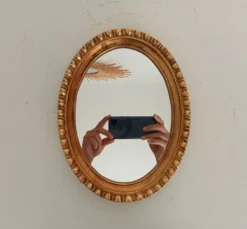 Miroir ovale italien vintage en bois doré