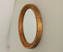 Miroir ovale italien vintage en bois doré
