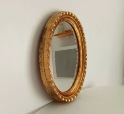 Miroir ovale italien vintage en bois doré