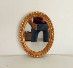 Miroir ovale italien vintage en bois doré