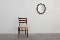 Miroir ovale néoclassique français en noir et or, 20e siècle