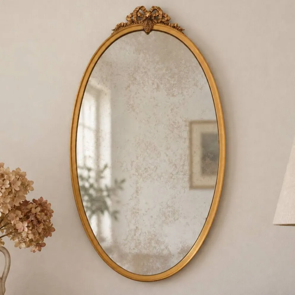 Miroir ovale vintage en métal doré à nœud – style Louis XVI / romantique
