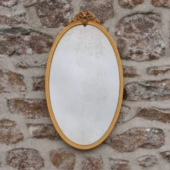 Miroir ovale vintage en métal doré à nœud – style Louis XVI / romantique
