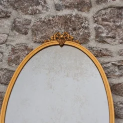Miroir ovale vintage en métal doré à nœud – style Louis XVI / romantique