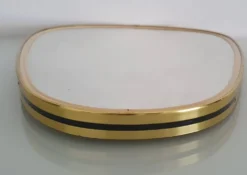 Miroir ovoïde vintage bords doré et noir - années 1960