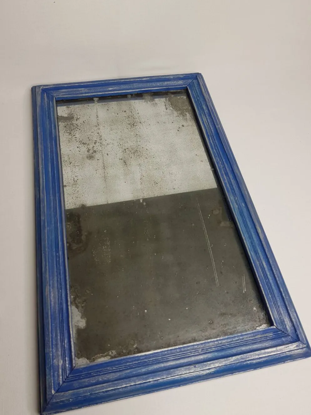 Miroir rectangulaire patine bleu et argent 28 X 46 cm