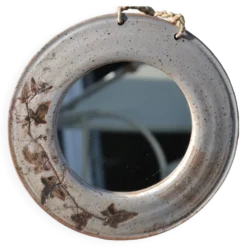 Miroir rond en céramique signé
