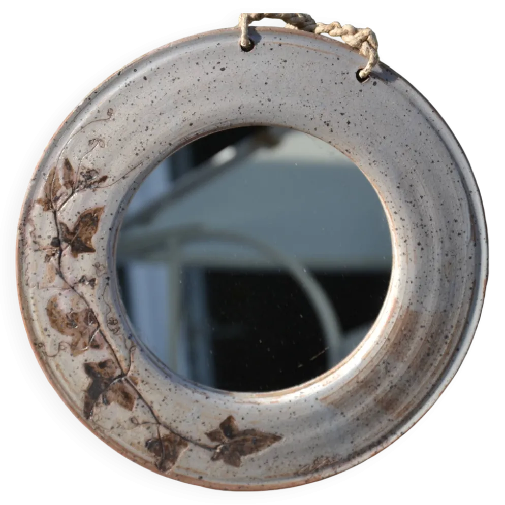 Miroir rond en céramique signé