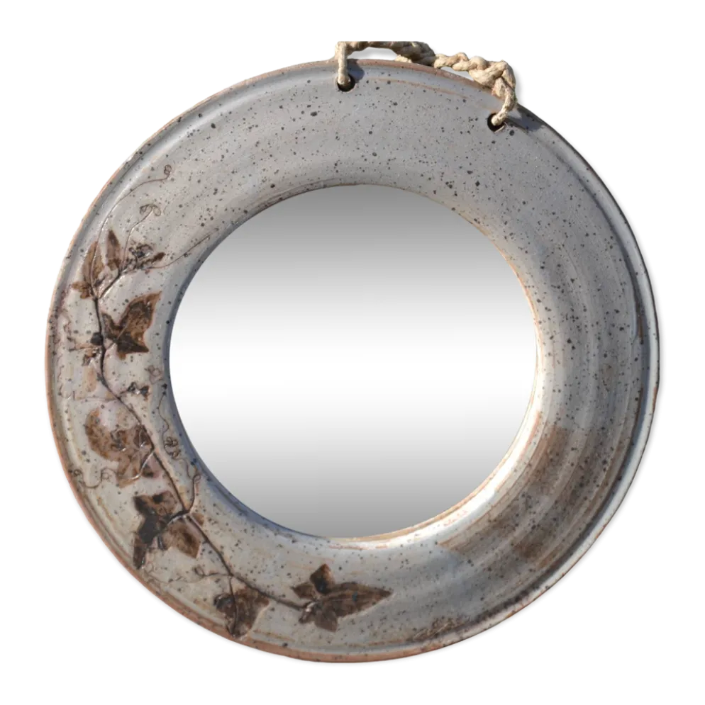 Miroir rond en céramique signé