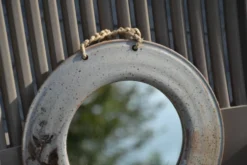 Miroir rond en céramique signé