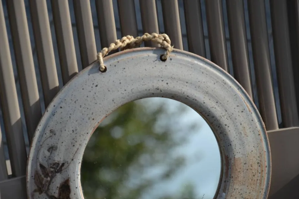 Miroir rond en céramique signé