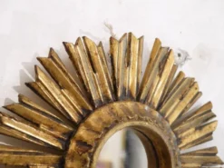 Miroir soleil en bois doré 1950