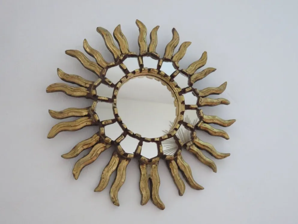 Miroir soleil en bois doré avec incrustations début XXème