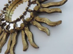 Miroir soleil en bois doré avec incrustations début XXème