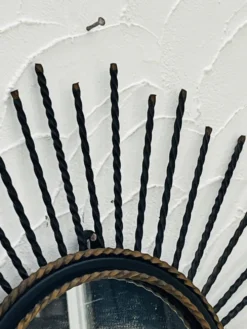 Miroir soleil vintage en métal noir et doré années 60