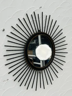Miroir soleil vintage en métal noir et doré années 60