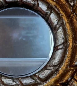 Miroir sorcière "Soleil" en bois doré à décor de feuilles d'acanthe