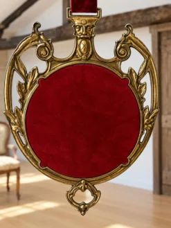 Miroir vintage en métal doré et velours bordeaux