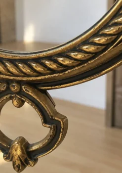 Miroir vintage en métal doré et velours bordeaux