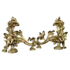 Paire de chenêts en bronze ciselé et doré d'après un modèle de Jacques Caffieri, Paris XIXème