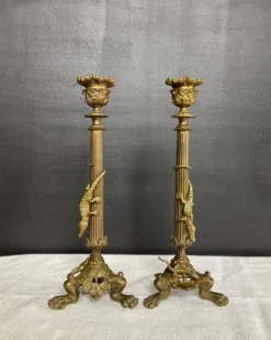 Paire de flambeaux XIXe en bronze doré style empire