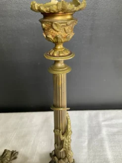 Paire de flambeaux XIXe en bronze doré style empire