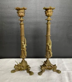 Paire de flambeaux XIXe en bronze doré style empire