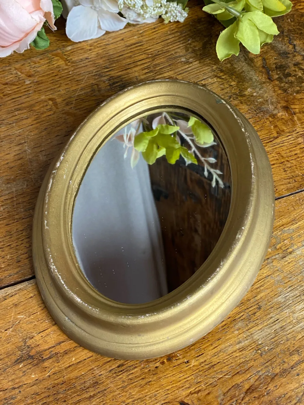 Petit miroir de forme ovale italien