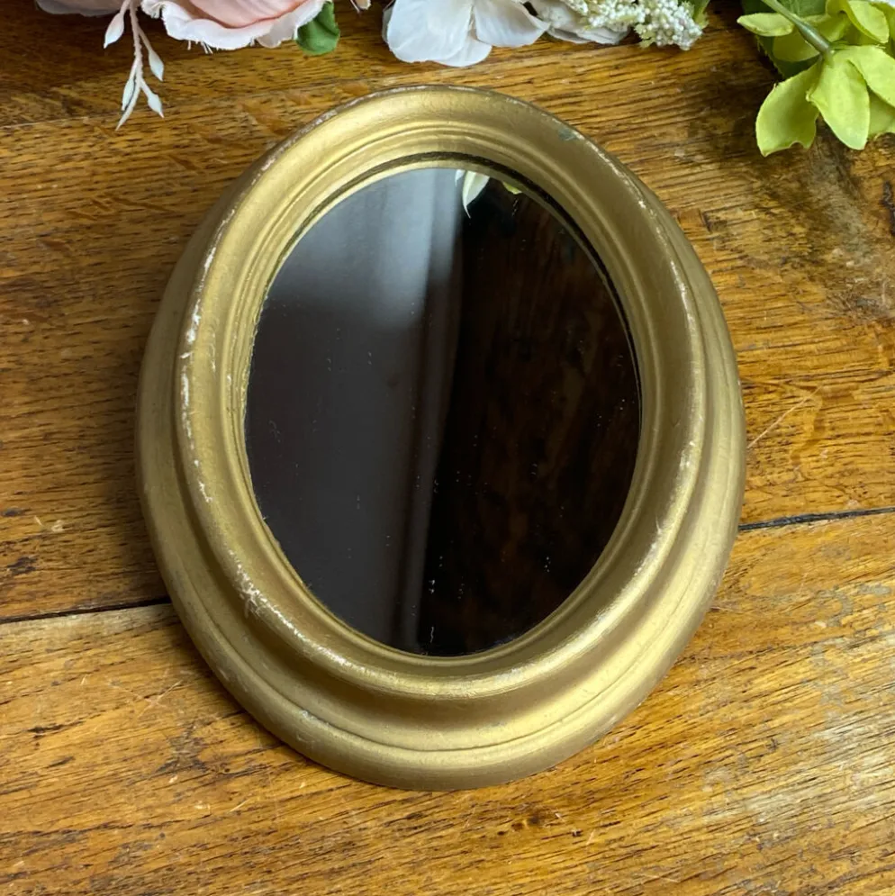Petit miroir de forme ovale italien