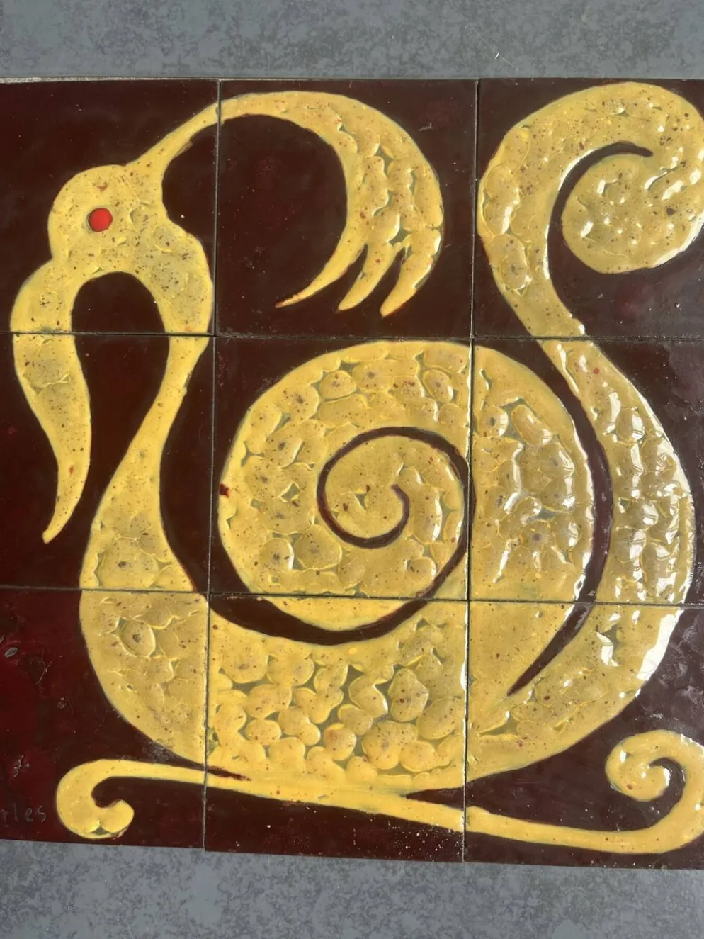 Plaque de céramique motif zoomorphe composée de 9 carreaux