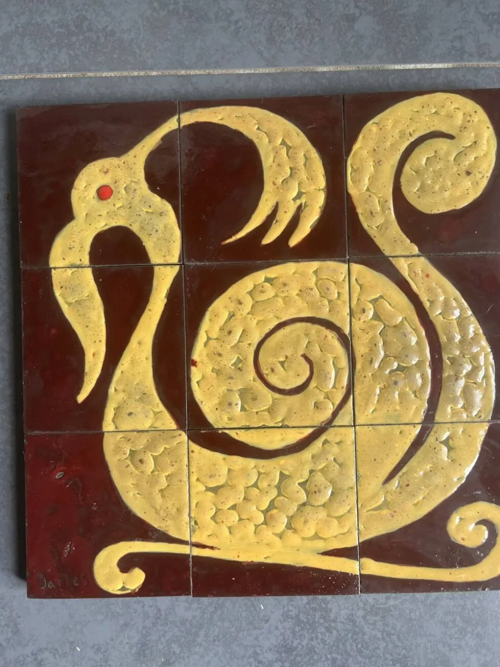 Plaque de céramique motif zoomorphe composée de 9 carreaux