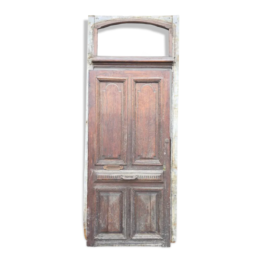 Porte d'entrée ancienne en chêne massif avec bâti