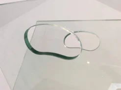 Porte-revues design en verre et acier brossé