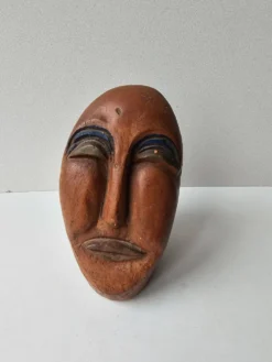 Sculpture visage en terre cuite style art africain