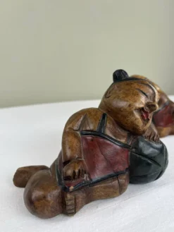 Serre livres en bois sculpté