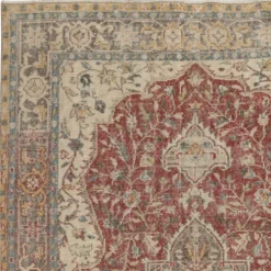 Tapis d'aire turc rouge vintage. Tapis en laine noué à la main avec un design de médaillon.