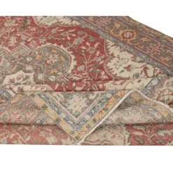 Tapis d'aire turc rouge vintage. Tapis en laine noué à la main avec un design de médaillon.
